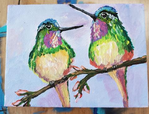 painting of two hummingbirds sitting on a branch