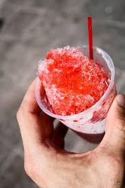 red snow cone in a plastic cup