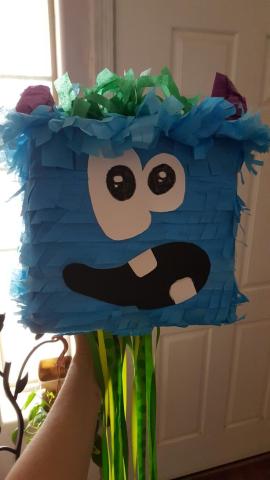 photograph of blue monster head pinata