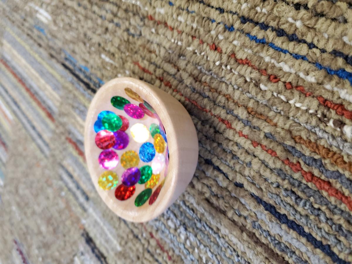 small wooden bowl with decorative inside