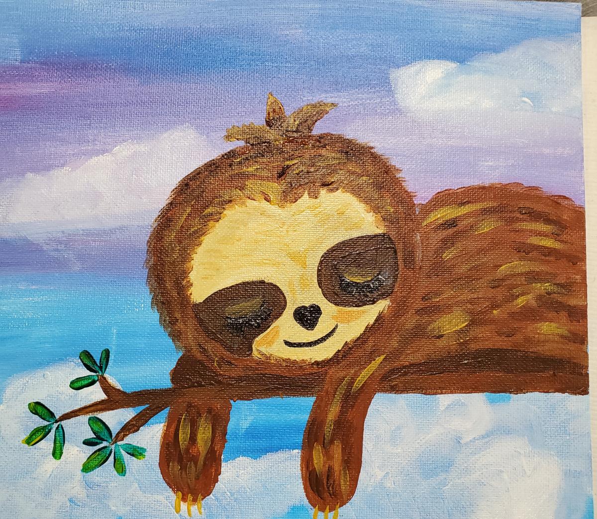 sleepy sloth on a branch before an evening sky